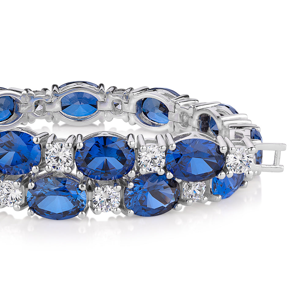 Oval and Round Brilliant tennis bracelet with sapphire simulants and 3.36 carats* of diamond simulants in sterling silver - Image 2