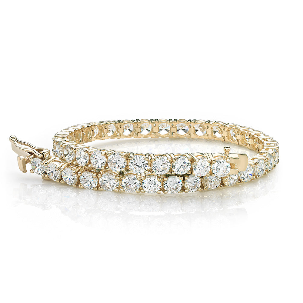 Round Brilliant tennis bracelet with 11 carats* of diamond simulants in 10 carat yellow gold