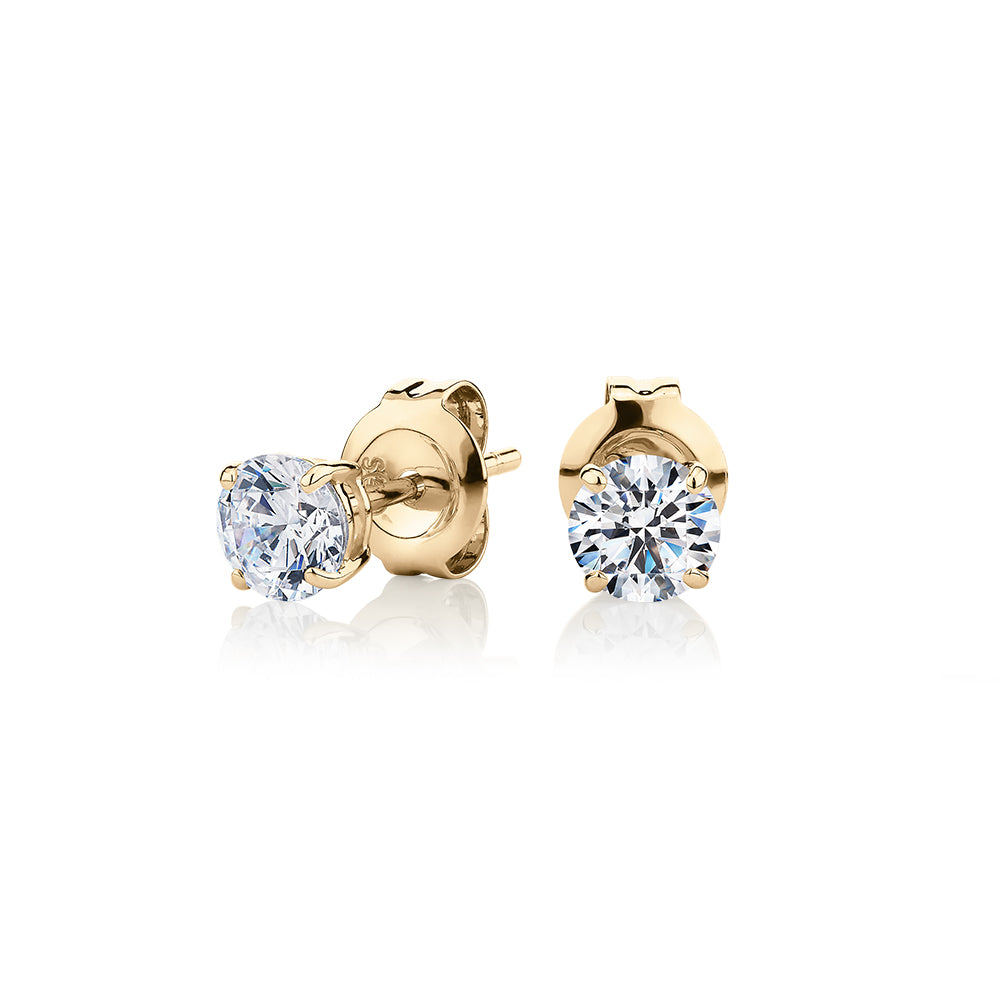 Round Brilliant stud earrings with 0.75 carats* of diamond simulants in 10 carat yellow gold