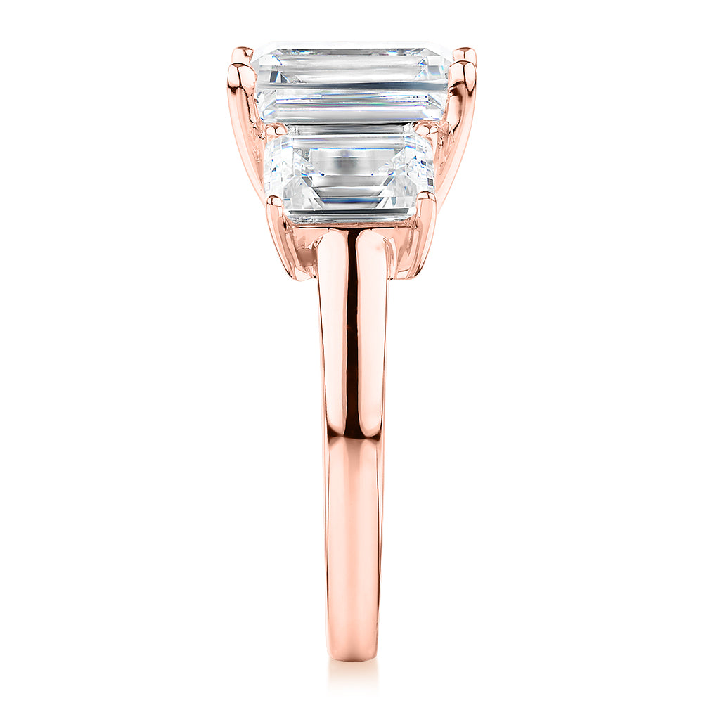 Three stone ring with 4.9 carats* of diamond simulants in 10 carat rose gold - Image 2