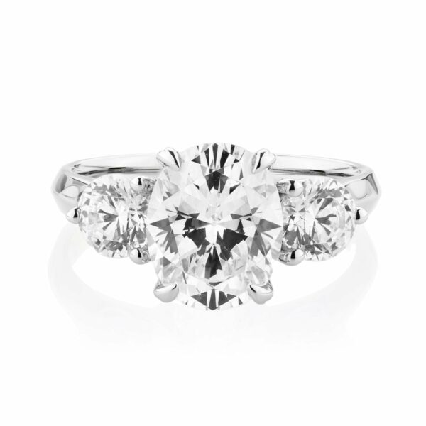 Three stone ring with 3.46 carats* of diamond simulants in 10 carat white gold