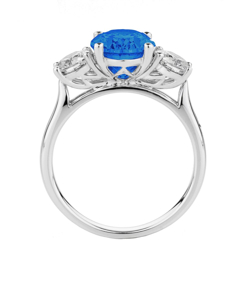 Three stone ring with 10x8mm ceylon sapphire simulant and 0.92 carats* of diamond simulants in 10 carat white gold - Image 2