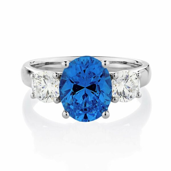 Three stone ring with 10x8mm ceylon sapphire simulant and 0.92 carats* of diamond simulants in 10 carat white gold