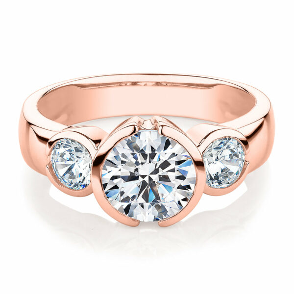 Three stone ring with 2.23 carats* of diamond simulants in 10 carat rose gold
