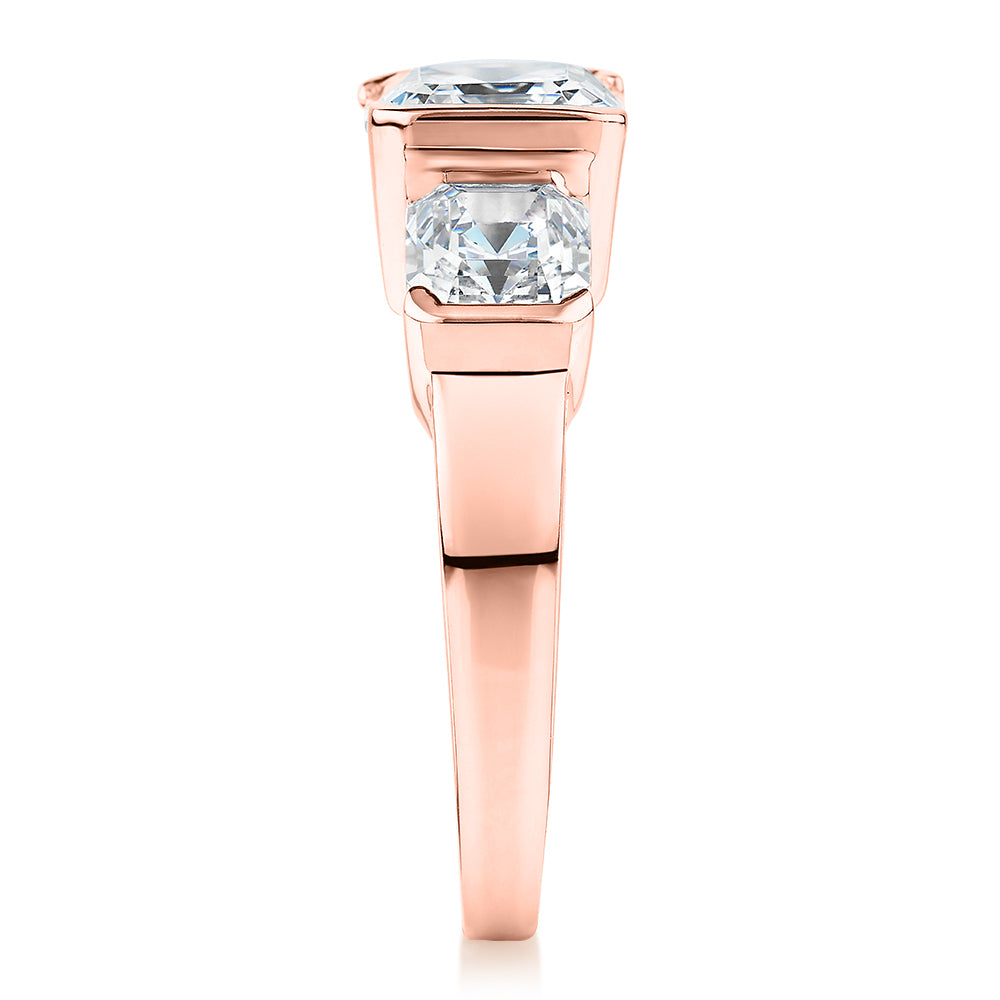 Three stone ring with 3.38 carats* of diamond simulants in 10 carat rose gold - Image 2