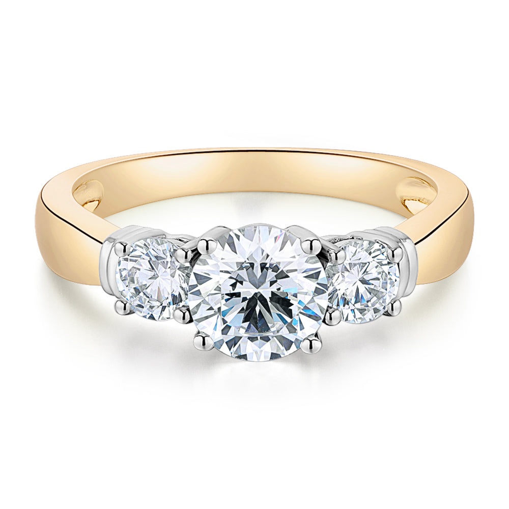 Three stone ring with 1.53 carats* of diamond simulants in 14 carat yellow and white gold