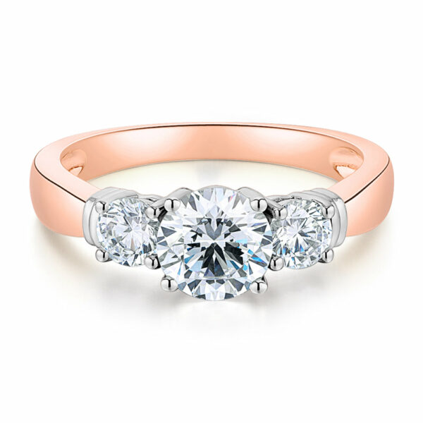 Three stone ring with 1.53 carats* of diamond simulants in 14 carat rose and white gold