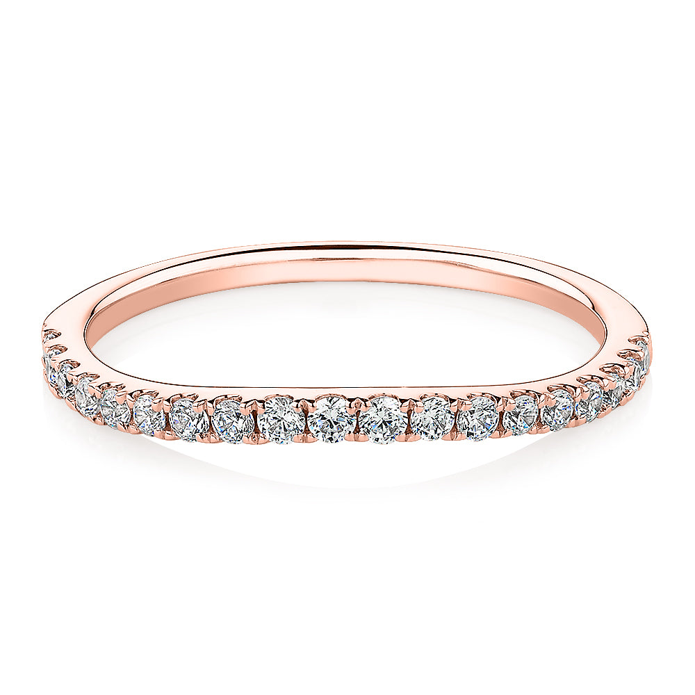 Curved wedding or eternity band with 0.25 carats* of diamond simulants in 10 carat rose gold