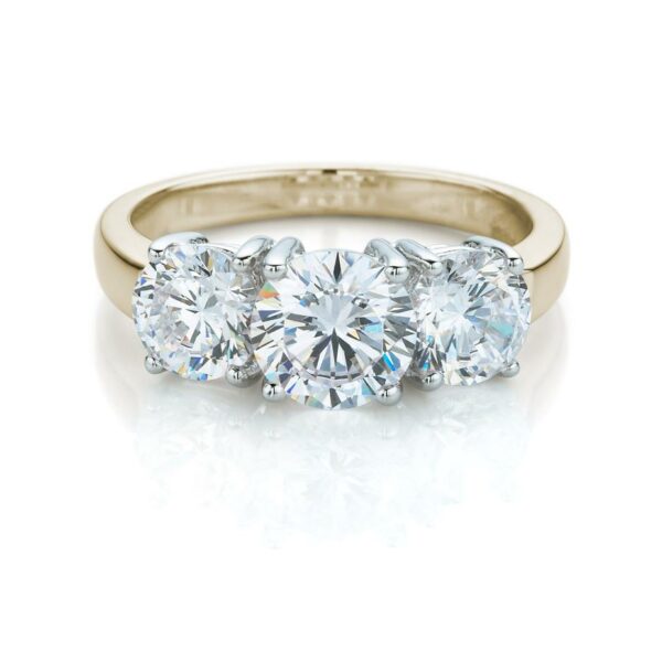Three stone ring with 2 carats* of diamond simulants in 10 carat yellow and white gold