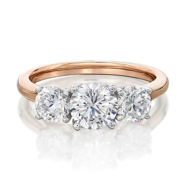 Three stone ring with 2 carats* of diamond simulants in 10 carat rose and white gold
