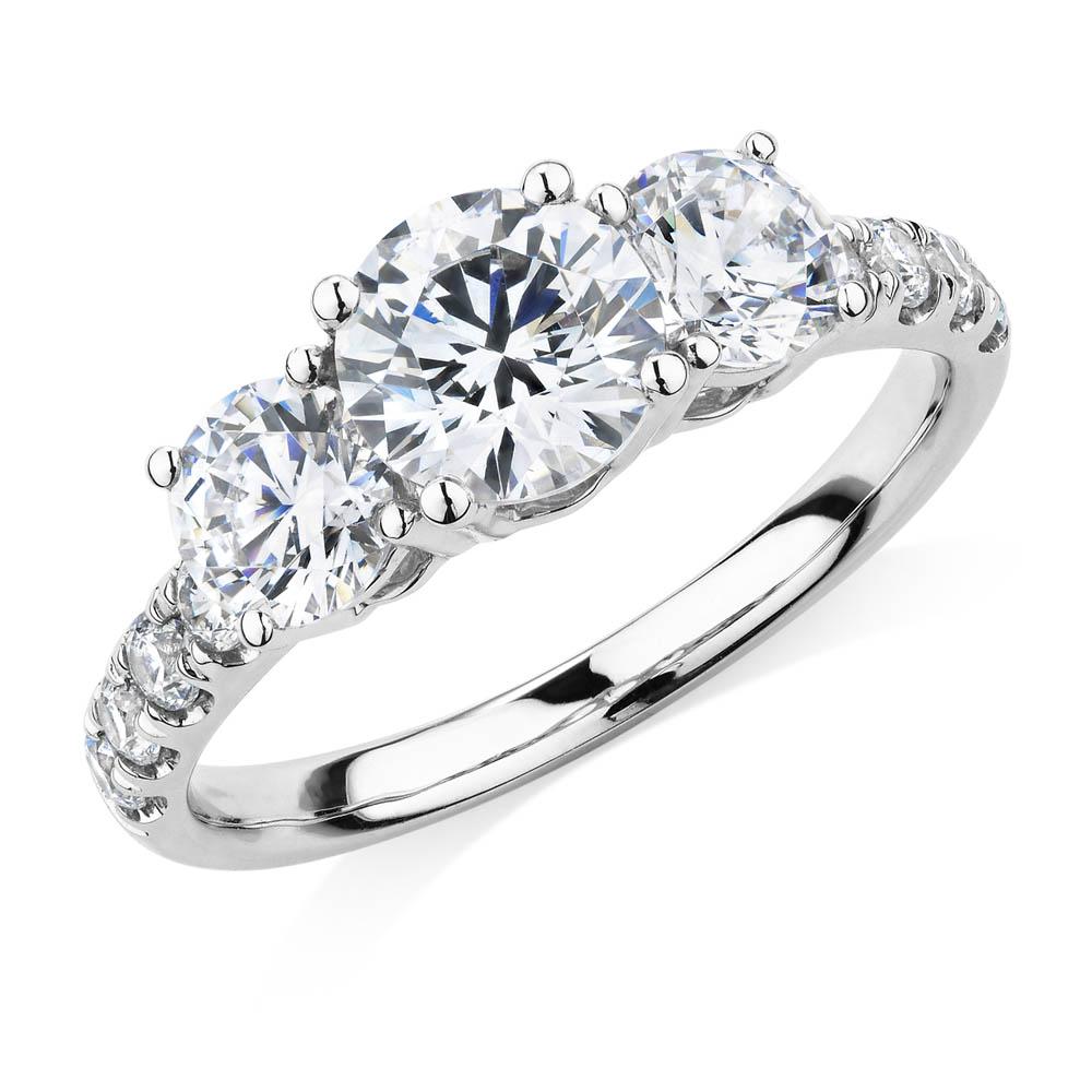 Three stone ring with 2.19 carats* of diamond simulants in 10 carat white gold - Image 4