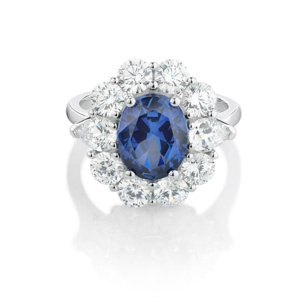 Dress ring with 10x8mm ceylon sapphire simulant and 2.7 carats* of diamond simulants in 10 carat white gold
