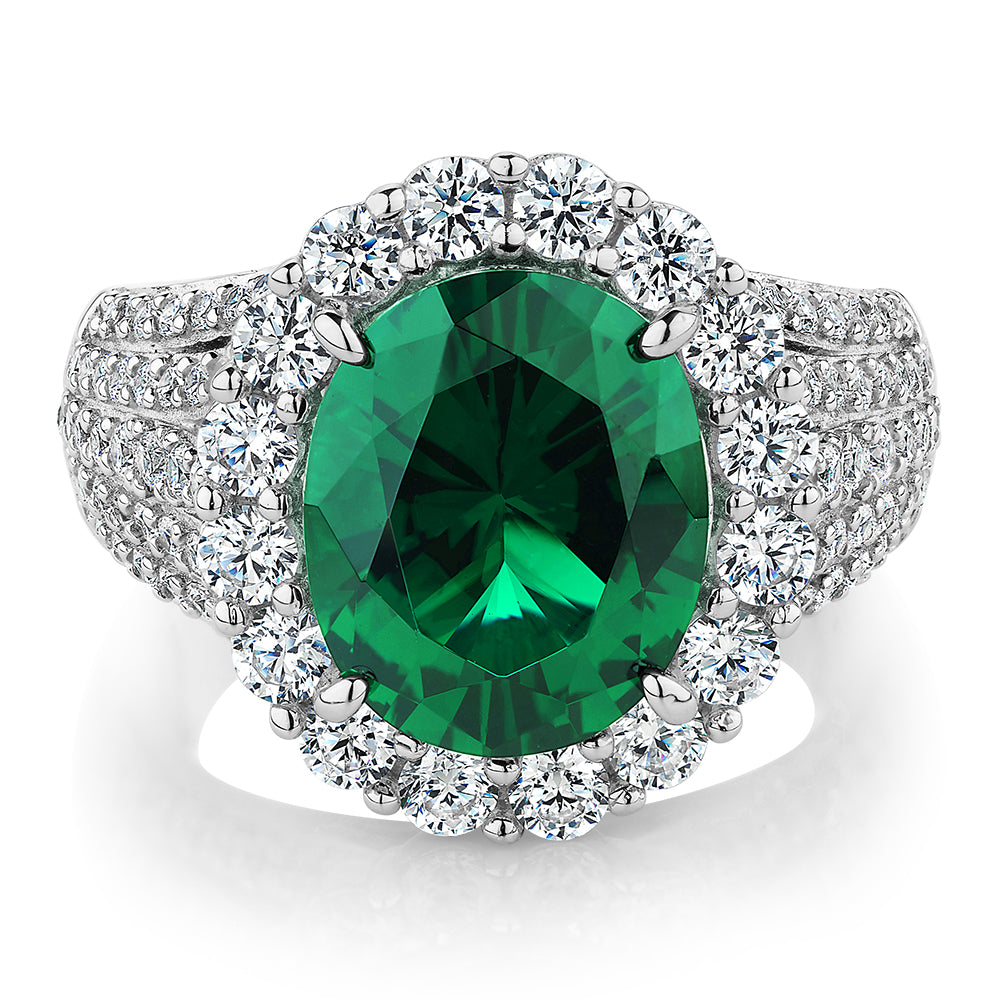 Dress ring with emerald simulant and 6.35 carats* of diamond simulants in sterling silver